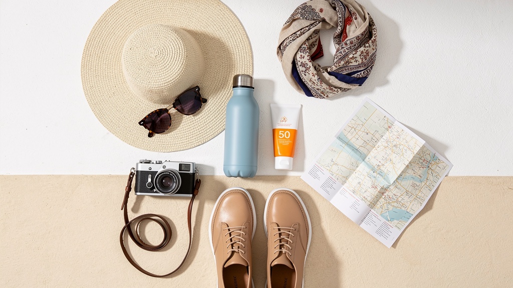 Day-trip packing essentials on a white background